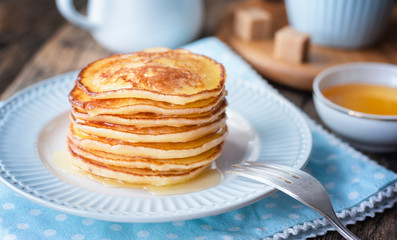 Pancake for breakfast in a blue plate.