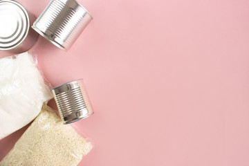 Food for quarantine isolation period flat lay on pink background with copy space. Sugar, rice,...