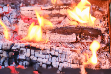 The background or texture of burning fire, smoke, wood, ash and coal.