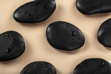 Massage spa stones close up in wavy water background
