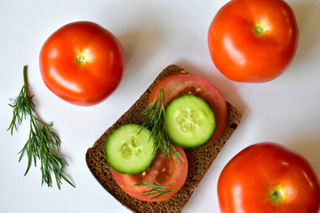 Diet sandwich with cucumber and tomato on a white background