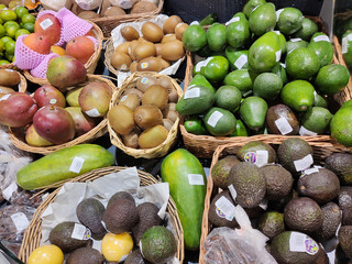 Avocados, coconuts, limes, kiwi and mangoes, fruit is beautiful in wooden plates