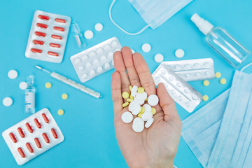 The doctor's hands are holding pills. cure for coronavirus. Medical remedies in the fight against...