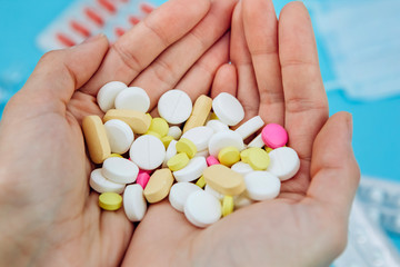 The doctor's hands are holding pills. cure for coronavirus. Medical remedies in the fight against...