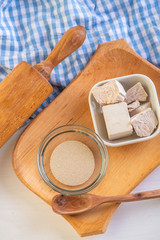 ingredients for baking Dry yeast crumbled and yeast block for baking.