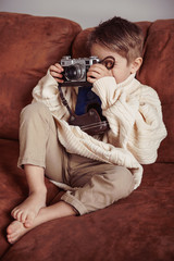 Boy with vintage camera 