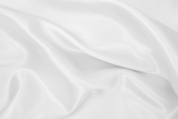 Smooth elegant white silk or satin luxury cloth texture as wedding background. Luxurious background design
