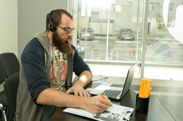 Online lesson. A young man conducts an online lesson during quarantine. Pandemic.