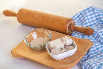 ingredients for baking Dry yeast crumbled and yeast block for baking.