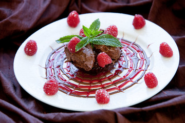 Chocolate Cup with Chocolate Mousse and Sugared Raspberries, Decorative Drizzle,  with Fresh Mint Garnish - Gourmet Dessert