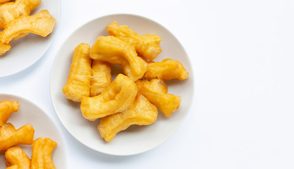 Deep-fried dough stick, chinese bread stick on white.