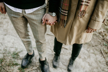 bride and groom holding hands