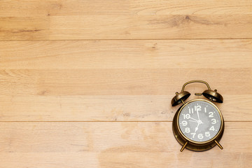 alarm 7 o' Clock on wood table  