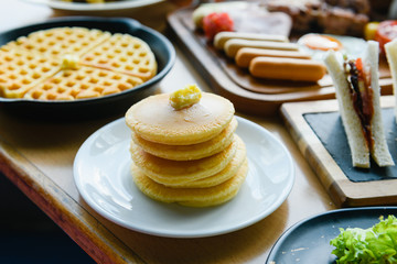 American pancakes and waffles at hotel breakfast