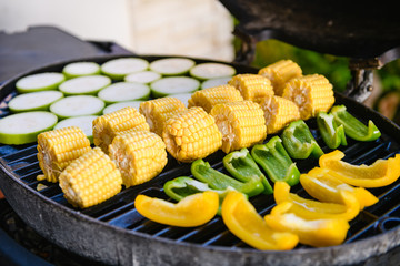 Beautiful vegetable slices on round bbq grill