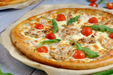 pizza with chicken fillet, tomatoes, mozzarella