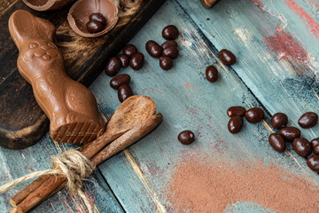 dark chocolate of different shapes on rustic wood to eat at special parties