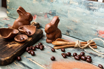 dark chocolate of different shapes on rustic wood to eat at special parties