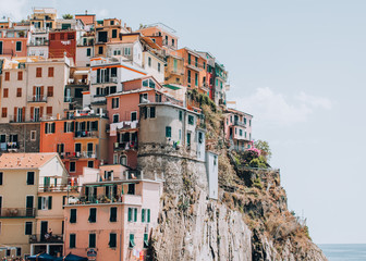 manarola / Italy - July 22 2016: stunning picturesque Manarola town Cinque Terre romantic filmic wall poster multicolored buildings