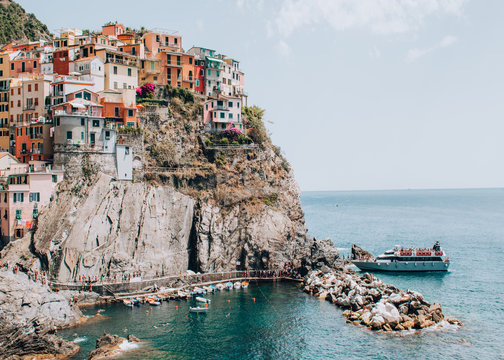manarola / Italy - July 22 2016: stunning picturesque Manarola town Cinque Terre romantic filmic wall poster multicolored buildings