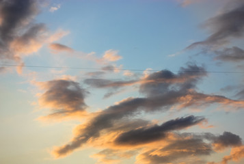 Contractual clouds in the sky before storm and rain in spring, city and cars