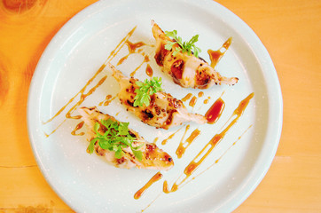 Delicious Jiaozi served with a sweet sauce