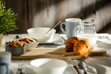 Breakfast on the table in the light of the morning sun