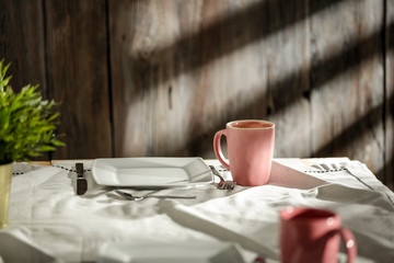 Breakfast on the table in the light of the morning sun