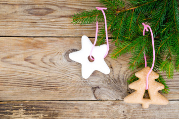 Christmas background, spruce branches on wooden surface