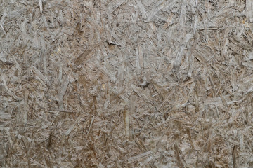 natural background from chipboard, glued chips of wood the natural color , texture of sawdust