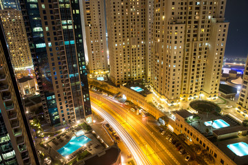 Highrise buildings at Dubai Marina illuminated at night
