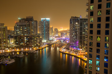Highrise buildings at Dubai Marina illuminated at night
