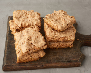 baked Krakow meringue cookies on a wooden board, delicious dessert of whipped egg whites