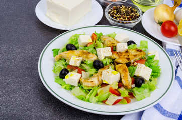 Vegetable salad with tofu and chicken breast.