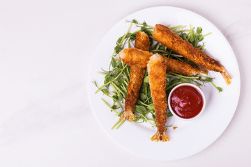 Tempura deep fried shrimp fish with tomato sauce. street food.
