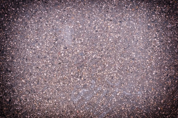 Toned photo of asphalt with a vignette. Background with pavement texture.