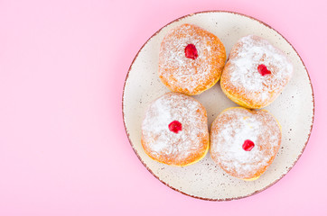 Traditional food doughnuts with icing sugar and jam. Concept and background Jewish holiday Hanukkah.