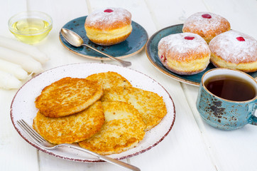 Concept and background Jewish holiday Hanukkah. Traditional food doughnuts and potatoes pancakes latkes. Flat lay or top view.