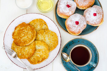 Concept and background Jewish holiday Hanukkah. Traditional food doughnuts and potatoes pancakes latkes. Flat lay or top view.