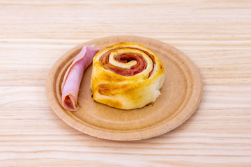 cinnamon roll with ham and cheese
