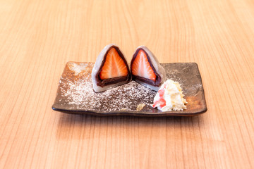 strawberry mochis on wooden table
