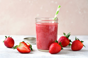 Fresh delicious strawberry banana smoothie in a mason jar.