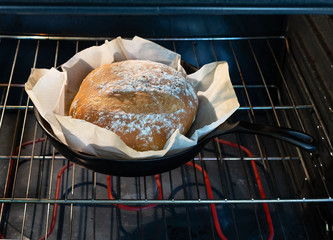 Homemade bread in hot oven.