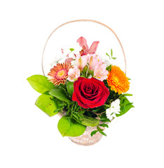 Wicker decorative basket with bouquet of beautiful flowers isolated on white background