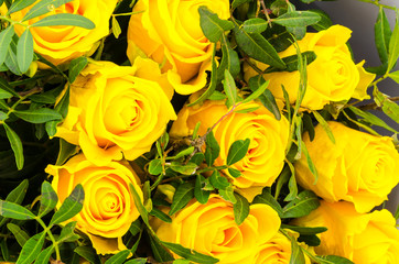 Bouquet of yellow roses in craft paper. Photo