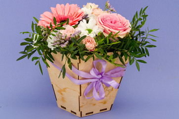 Flowers, bouquet in stylish wooden box. Studio Photo