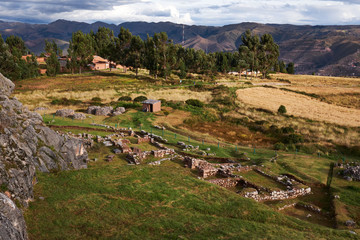 Fototapeta na wymiar A view of Inca ruins from up on a hill