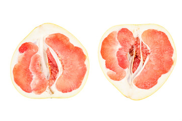 Halves of red chinese sliced pamelo on white background.