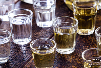 glasses of alcoholic drink, small dose. Rum, vodka, vermouth, cachaça, gin and liquor.