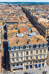 Fototapeta na wymiar Skyline aerial view of Bordeaux old town, Nouvelle-Aquitaine region, France. View from Bordeaux Cathedral (Cathedrale Saint-Andre). Historic part of the city is on the UNESCO World Heritage List